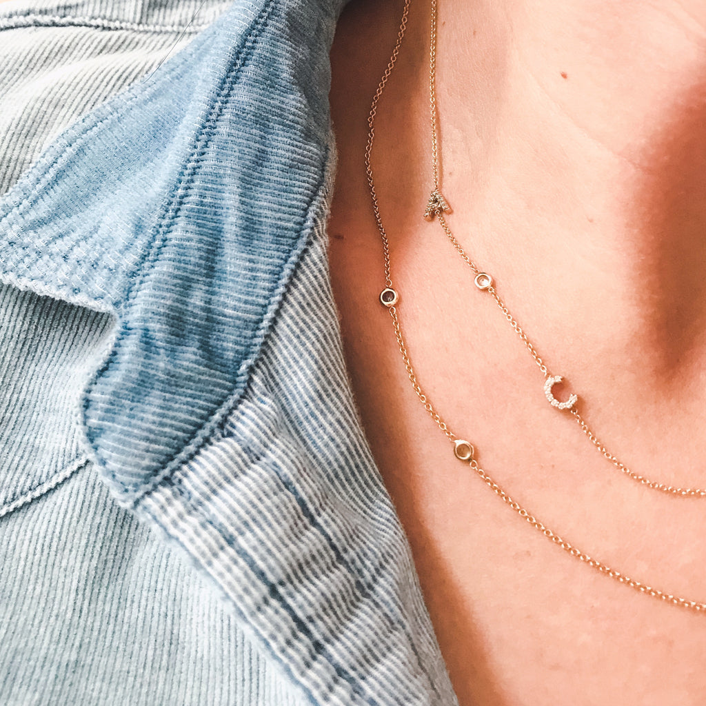 Layer up with the 14K Mini Initial Necklace pairs well with the 14K Birthstone Necklace. 