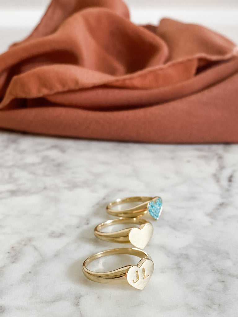 Ring may be engraved, up to three letters. Keep it simple with solid gold. Add turquoise for a bolder look.