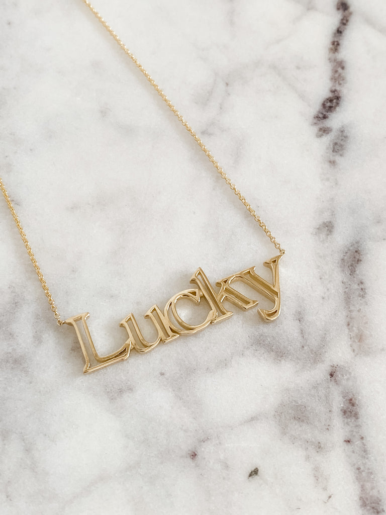 The Lucky Necklace on a marble slab.