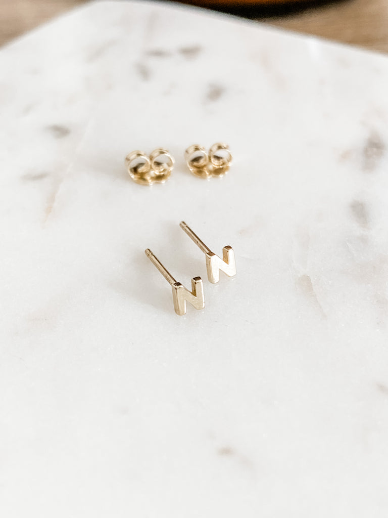 A pair of the letter N earrings in 14K Yellow Gold.