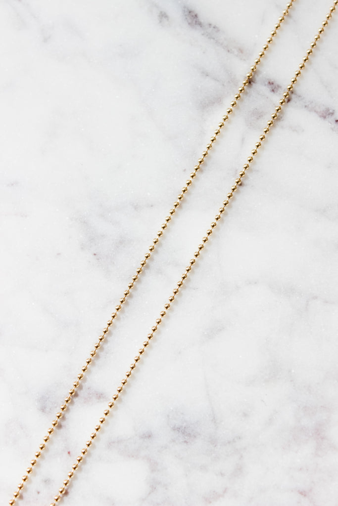 Our 14K Bead Chain is perfect for our charms! Minimal and dainty!  Details:  Shown in 14K Yellow Gold Available in 14K Yellow Gold, 14K Rose Gold, 14K White Gold.