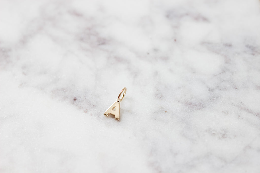 Letter A charm in 14K Yellow Gold. 