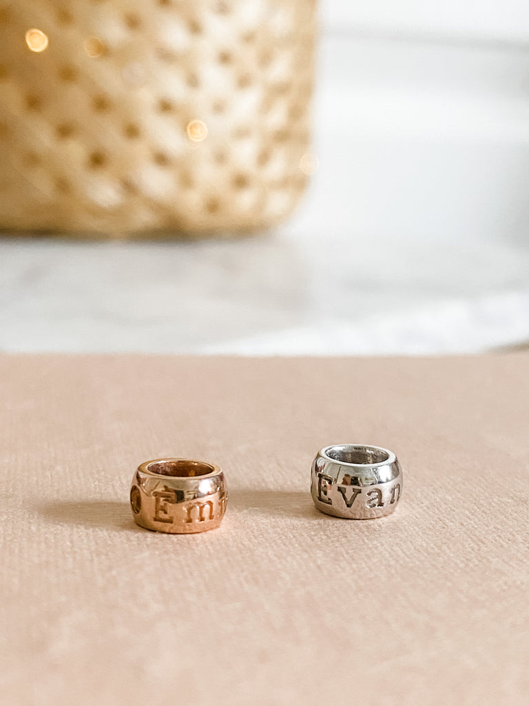 2 Personalized Bead Charms. A name engraved on both. 14K Rose Gold and 14K White Gold. 